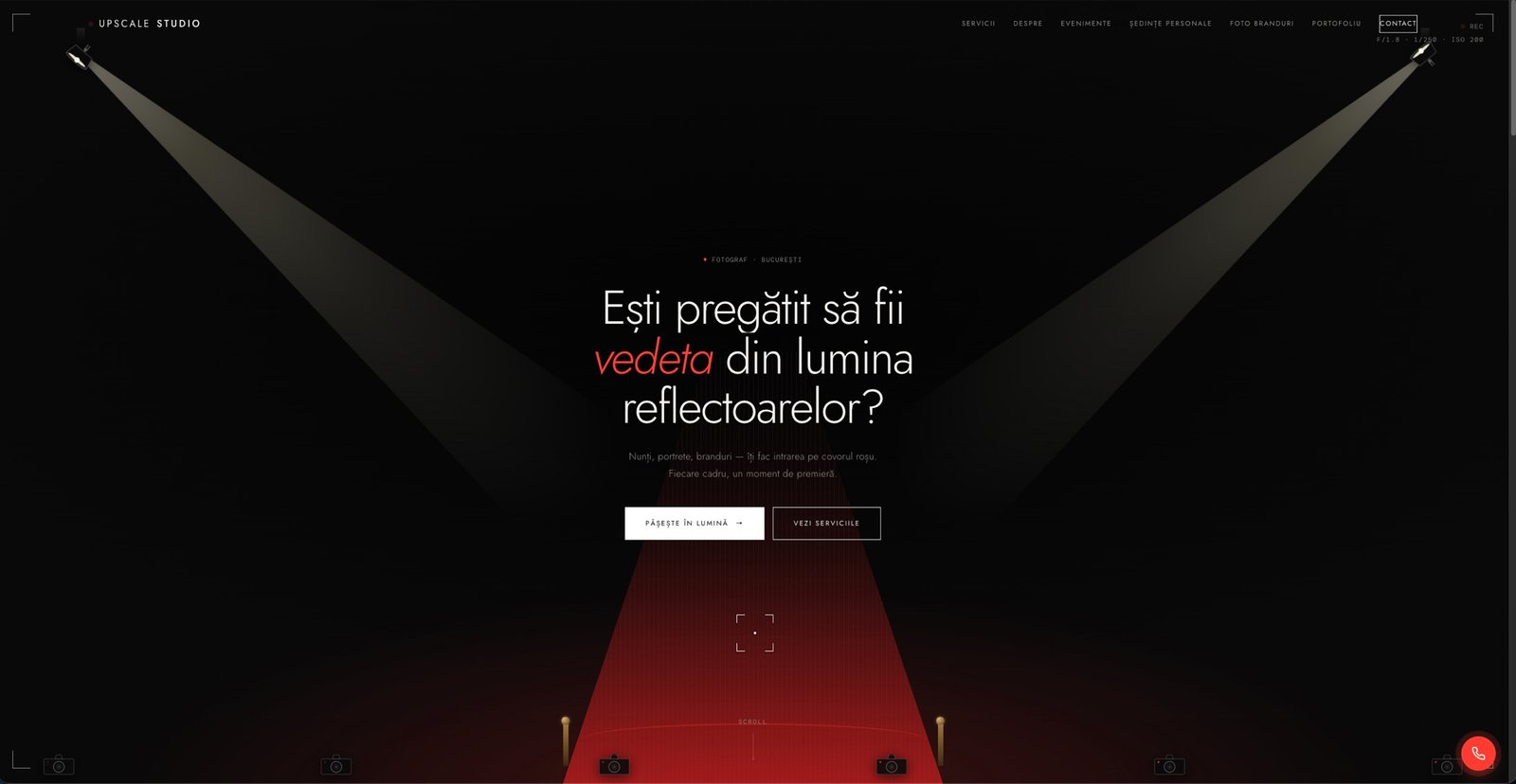 Homepage Upscale Studio — hero dark cu reflectoare și covor roșu